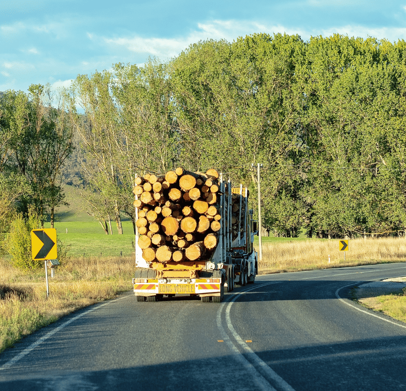 Semi truck hauling wood logs