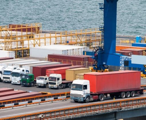 Trucks parked at an ocean port