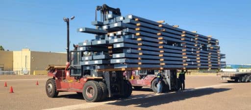 Forklift with steel in the Melton Logistics Laredo yard